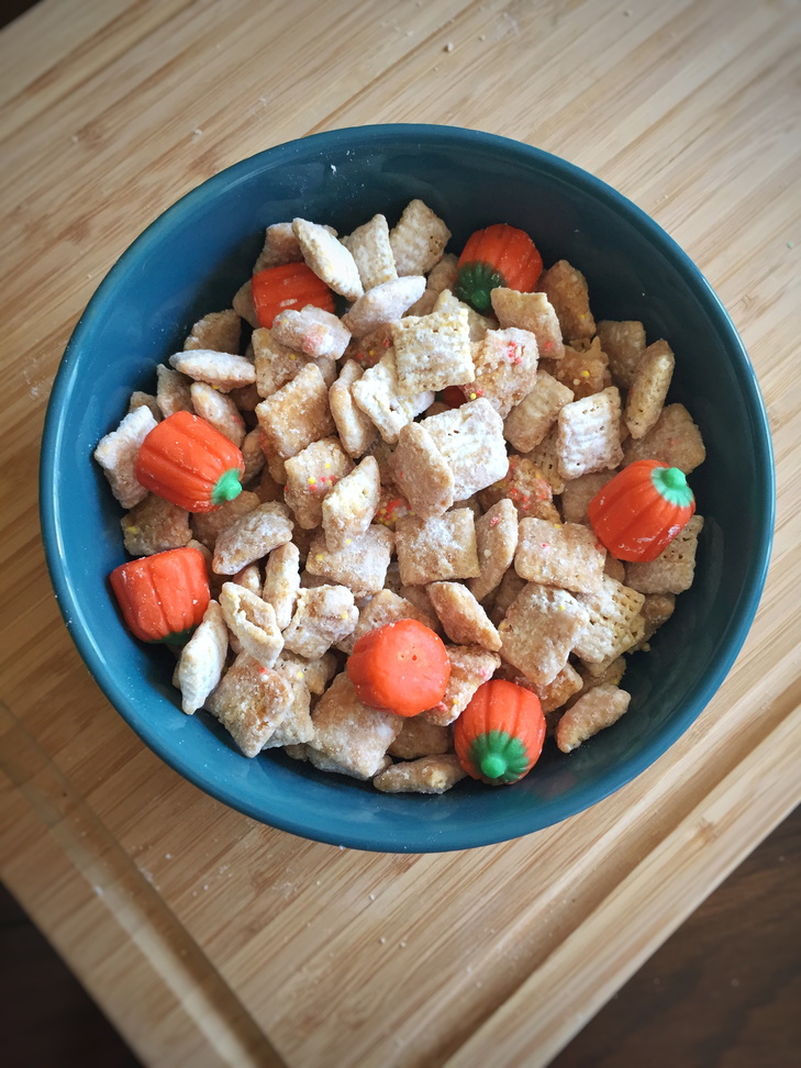 Candy corn or these mallowcreme pumpkins make this puppy chow festive for Halloween!